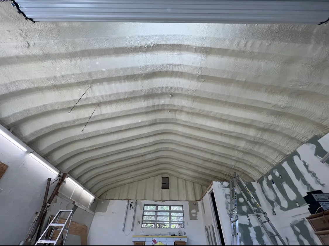 Spray polyurethane foam applied to the underside of a metal roof deck in Zeeland